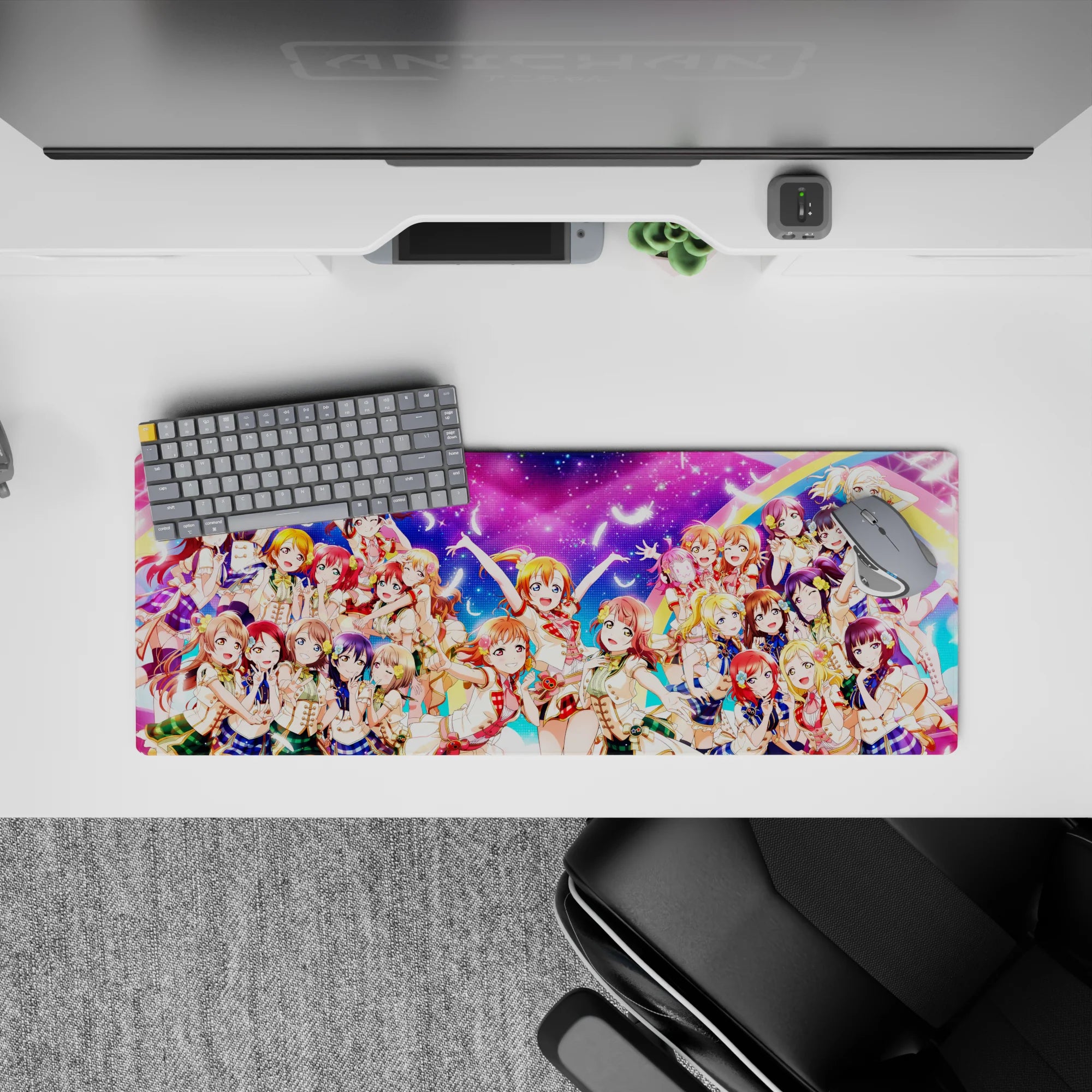 Neon pink and candy blue anime girl mouse pad 32x12 inches with rainbow arcs and bright idol energy.
