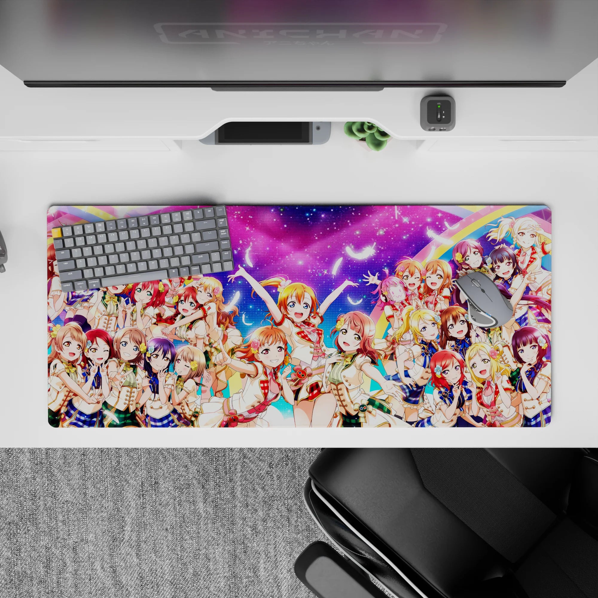 Neon pink and candy blue anime girl desk pad with rainbow arcs and bright happy vibe, 36x16 inches.