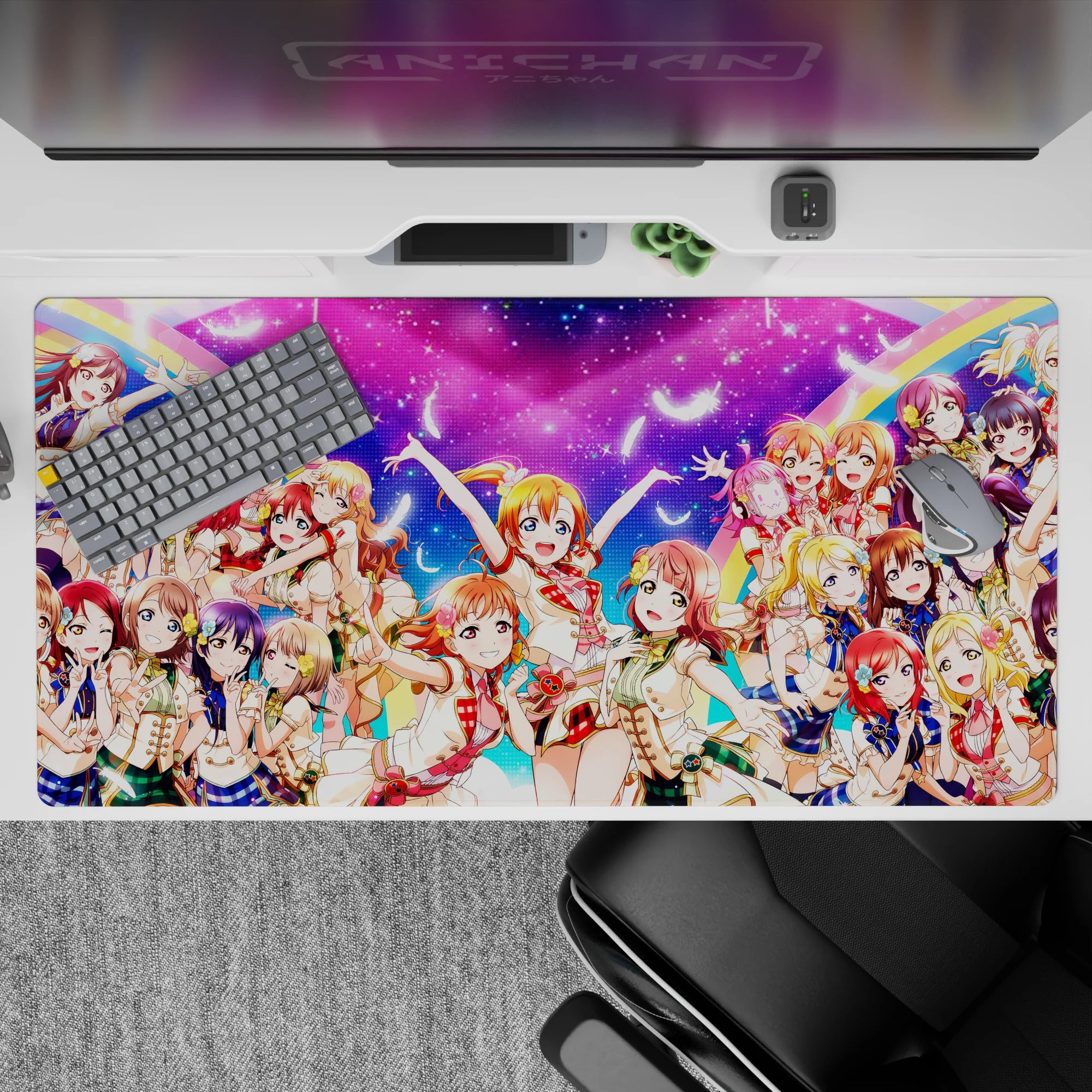 Neon pink and candy blue rainbow anime girl desk pad with bright cheerful idol vibe, 40x20 inches.