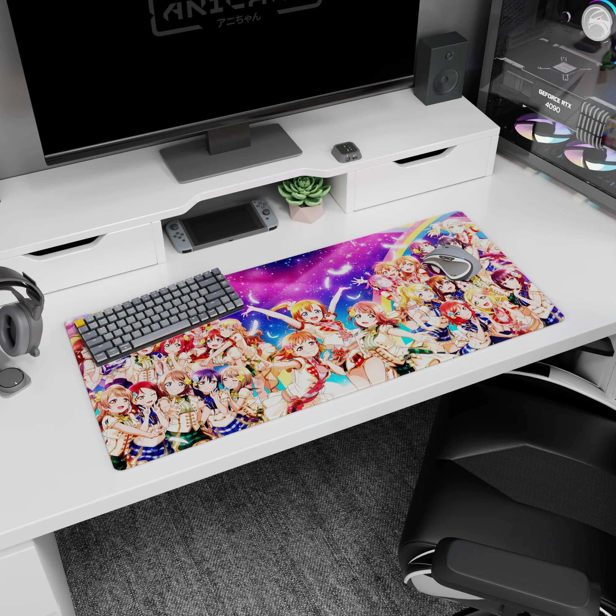 Honoka Kousaka, Kotori Minami, and Umi Sonoda anime girl desk pad in a group-hug scene, 36x16 inches.