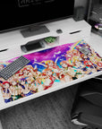 Honoka Kousaka, Kotori Minami, and Umi Sonoda smiling on anime girl desk pad, 40x20 inches.