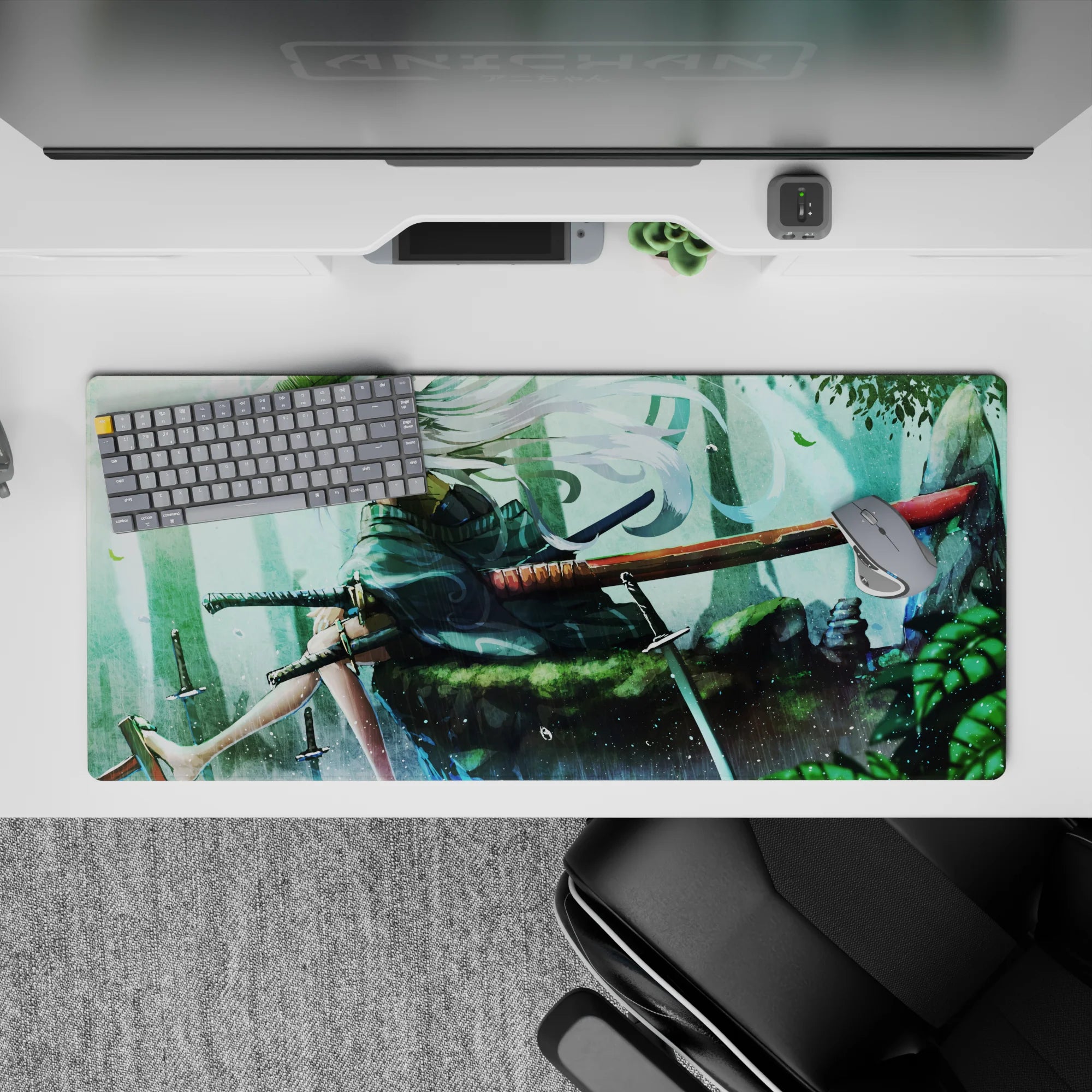 36x16 inches anime desk pad in misty teal greens with rain, ink-splash shadows, and drifting petals.