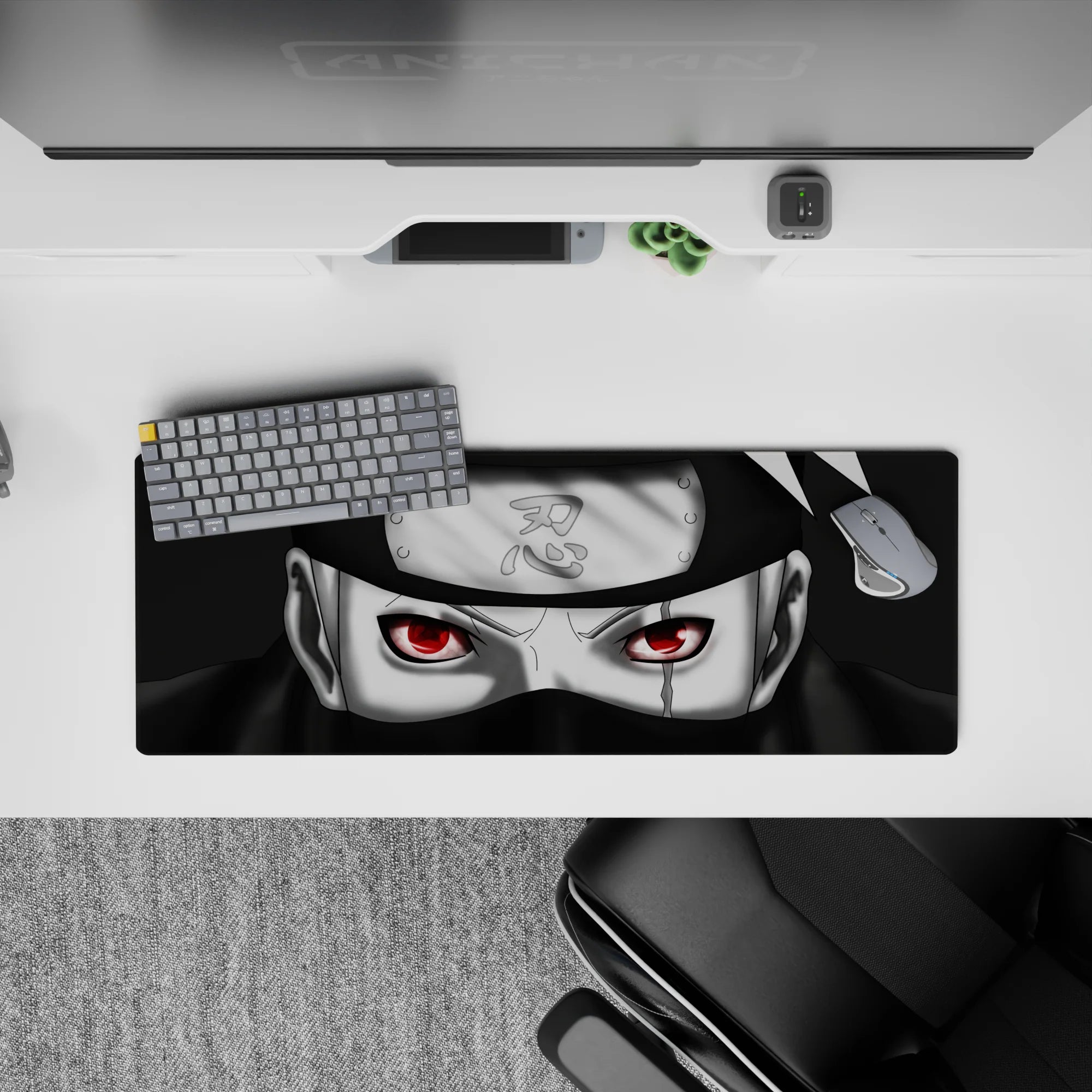 32x12 inches anime mouse pad in deep blacks and cool greys with a red Sharingan glow, sleek and intense.
