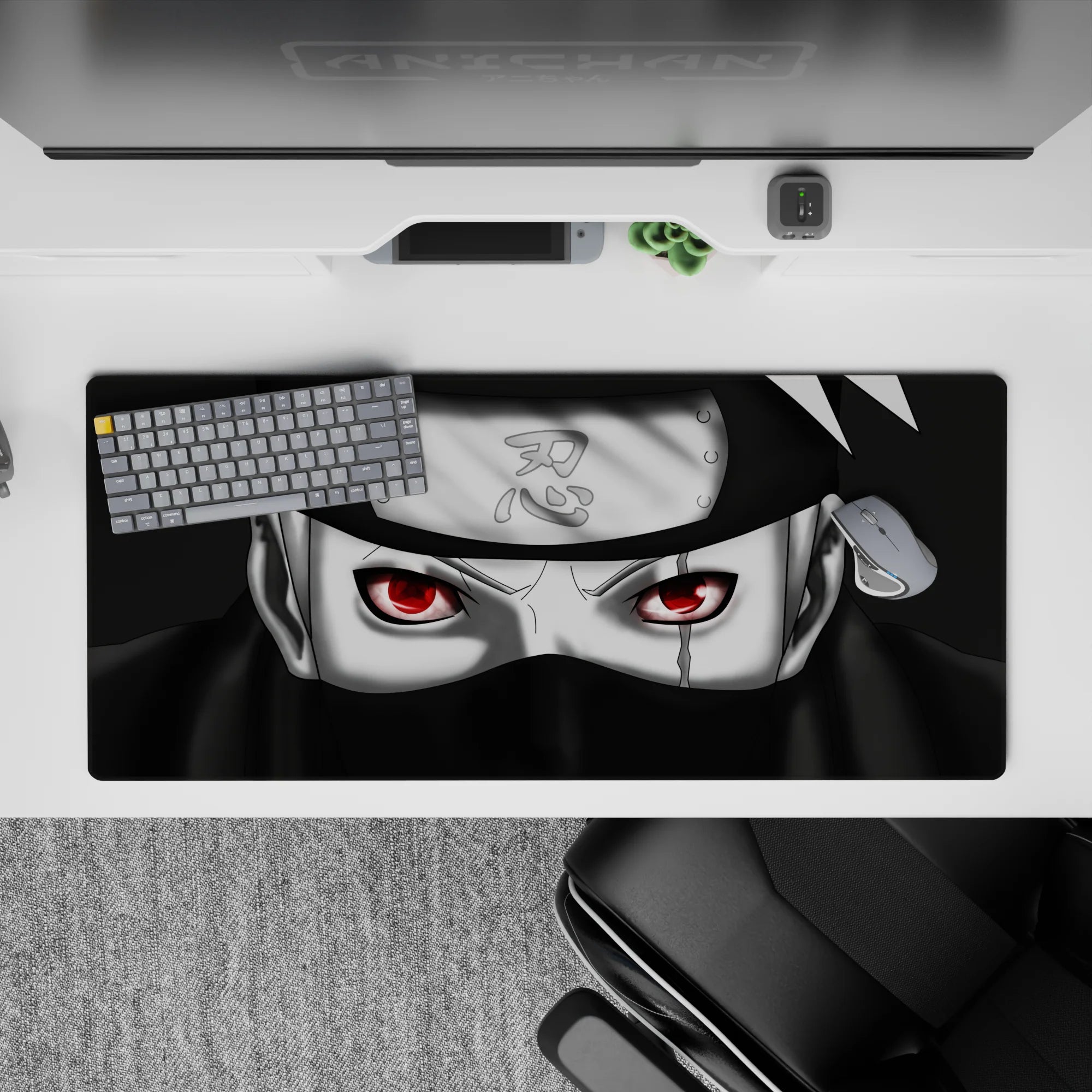 Dark black and cool grey desk pad 36x16 inches with red Sharingan glow, calm stealth vibe.