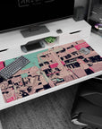 40x20 inches anime desk pad showing three pastel-haired girls busking under pink shop signs beneath a teal sky.