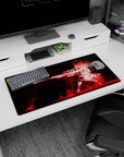 Kneeling anime girl with flowing hair and long sniper rifle on mouse pad 32x16 inches, dramatic scene.