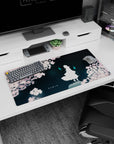 32x16 inches anime mouse pad showing a white figure under sakura blossoms with two cyan ghost flames nearby.