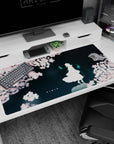 40x20 inches anime desk pad showing a lone white figure under sakura petals with two cyan will-o'-wisps.