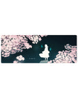 32x12 inches anime mouse pad with sakura petals framing a lone white silhouette on deep teal sky.