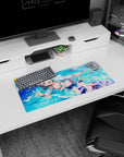 28x12 inches anime girl mouse pad featuring a smiling girl with water droplets, peace sign, and beachy backdrop.