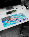 32x16 inches mouse pad featuring a cute anime girl with water droplets, pastel hoodie, and cheeky peace sign.