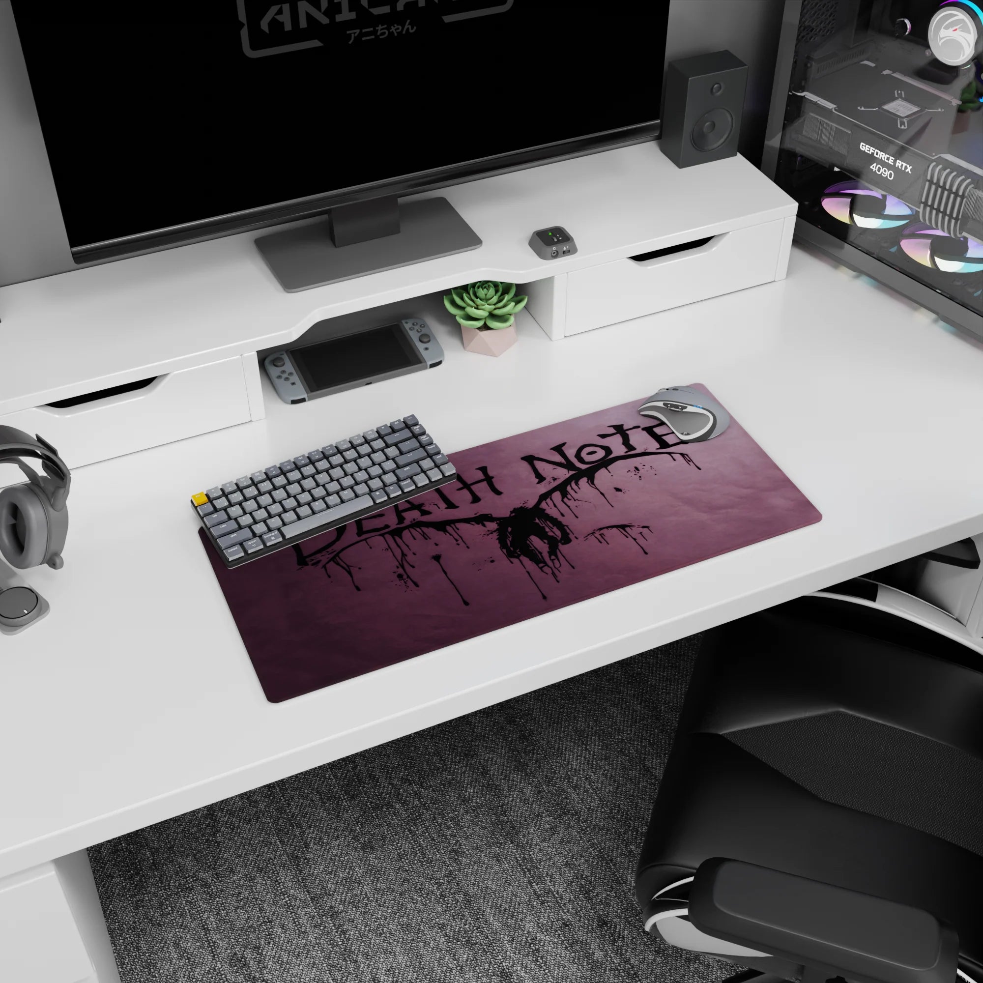 Winged shinigami figure spread wide on Death Note anime mouse pad 28x12 inches with ink splatter backdrop.