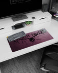 Winged shinigami figure spread wide on Death Note anime mouse pad 28x12 inches with ink splatter backdrop.