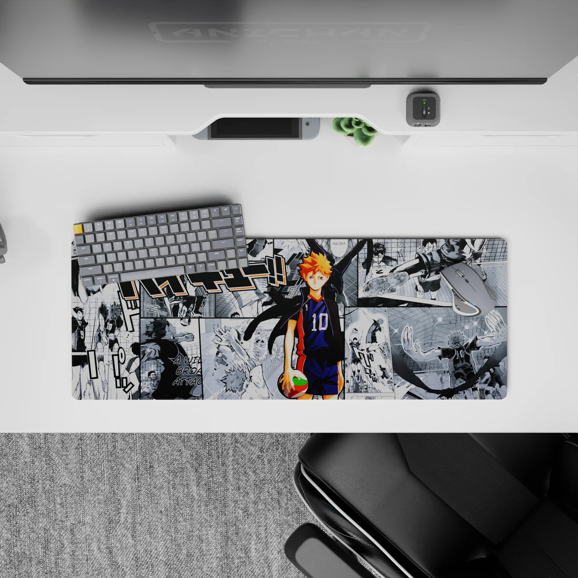 32x12 inches anime mouse pad in bold black-and-white with vivid orange hair, high-energy gym match mood.