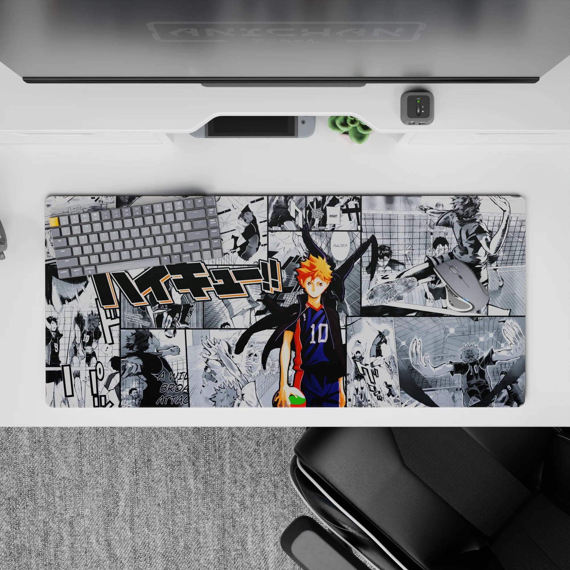Black-and-white manga backdrop with bright orange hair and navy accents, Haikyuu desk pad 36x16 inches.