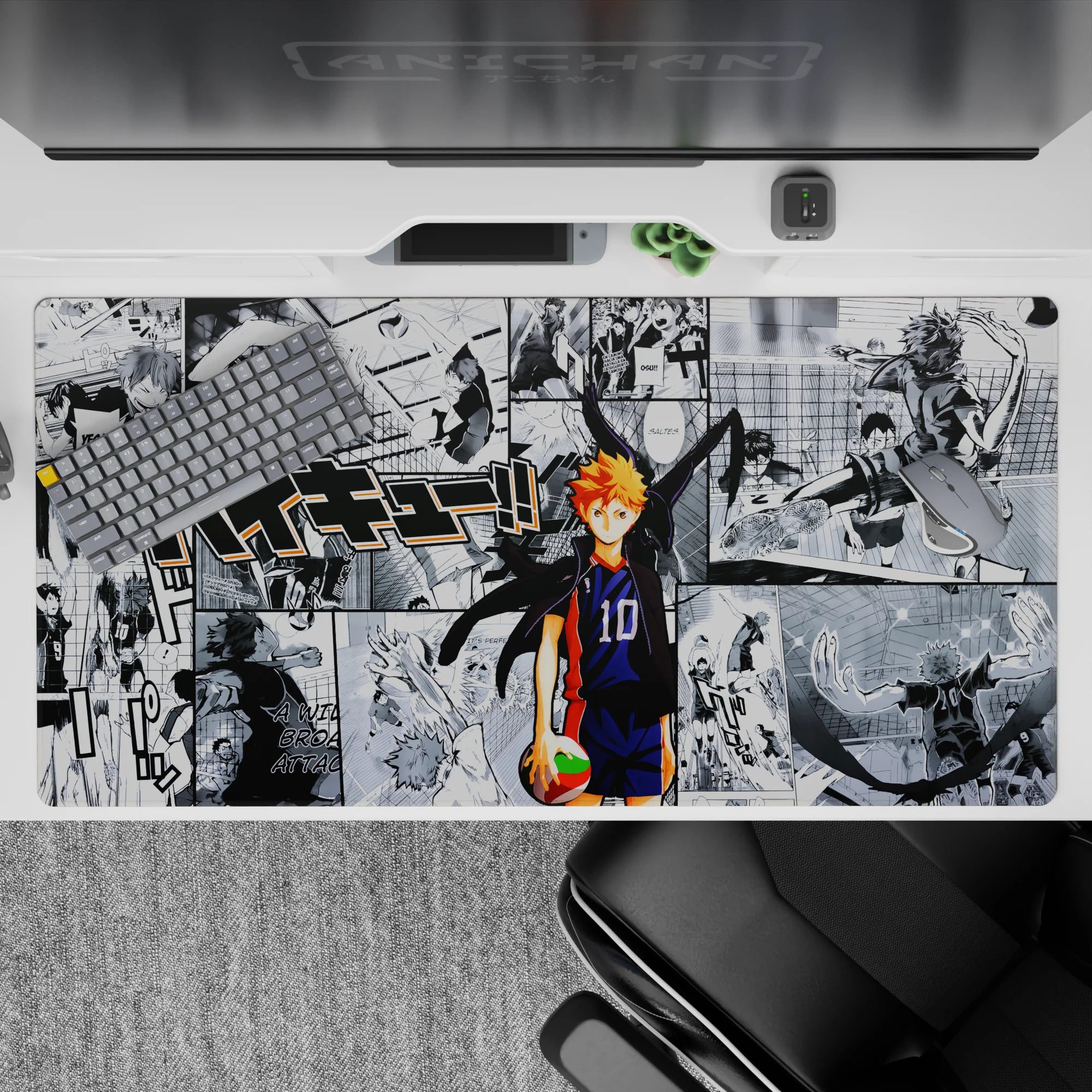 40x20 inches anime desk pad in navy, orange, and high-contrast manga panels for a sweaty gym vibe.
