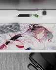 Watercolor anime desk pad 36x16 inches in pale pink, milky white, smoky gray, with bold black blade contrast.