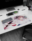 Calm anime girl gripping a black katana amid drifting cherry blossoms on mouse pad 32x16 inches.