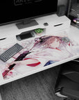 Katana-wielding anime girl with drifting cherry blossoms on a 40x20 inches desk pad.