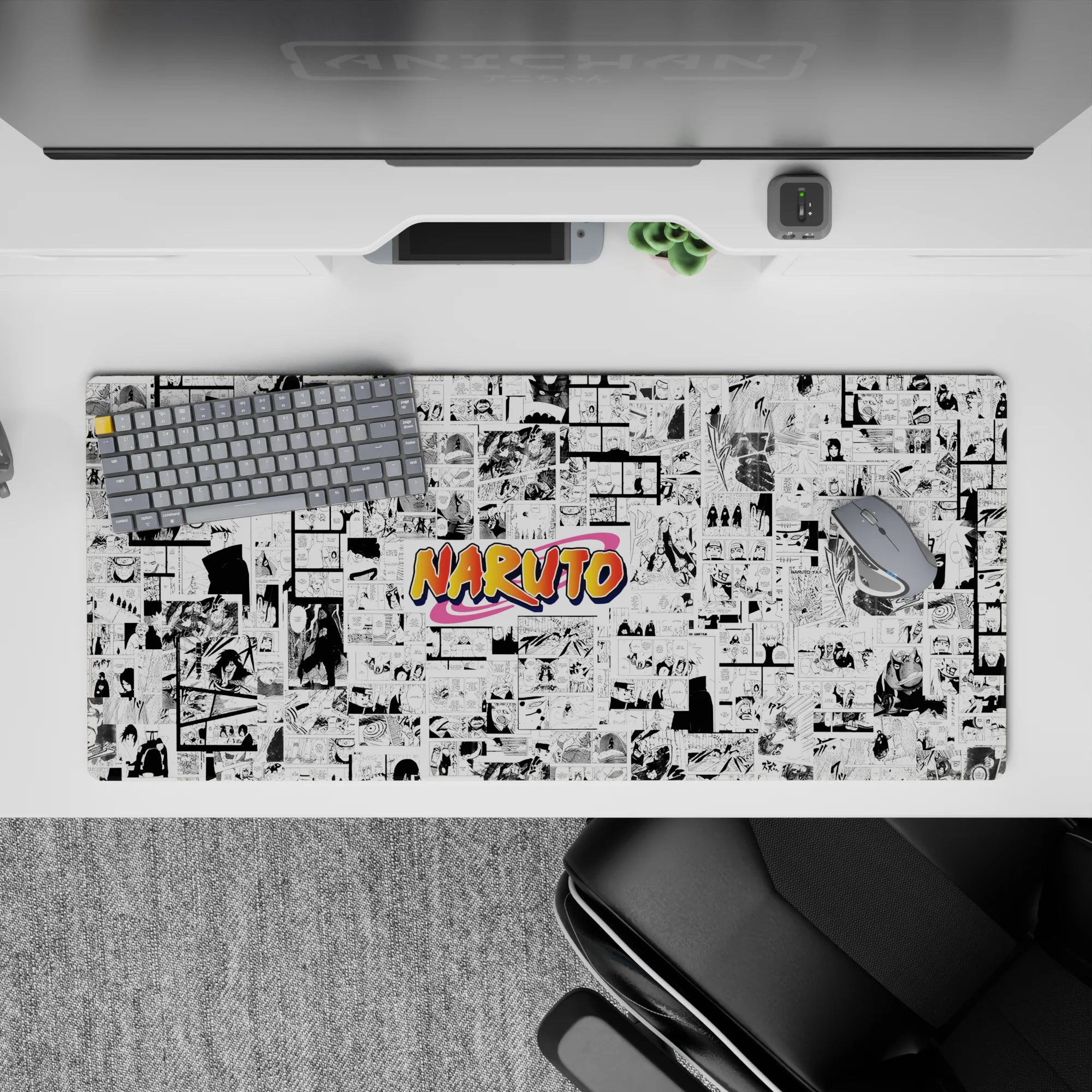 36x16 inches anime desk pad in crisp black and white with a bright orange pop, energetic shonen vibe.