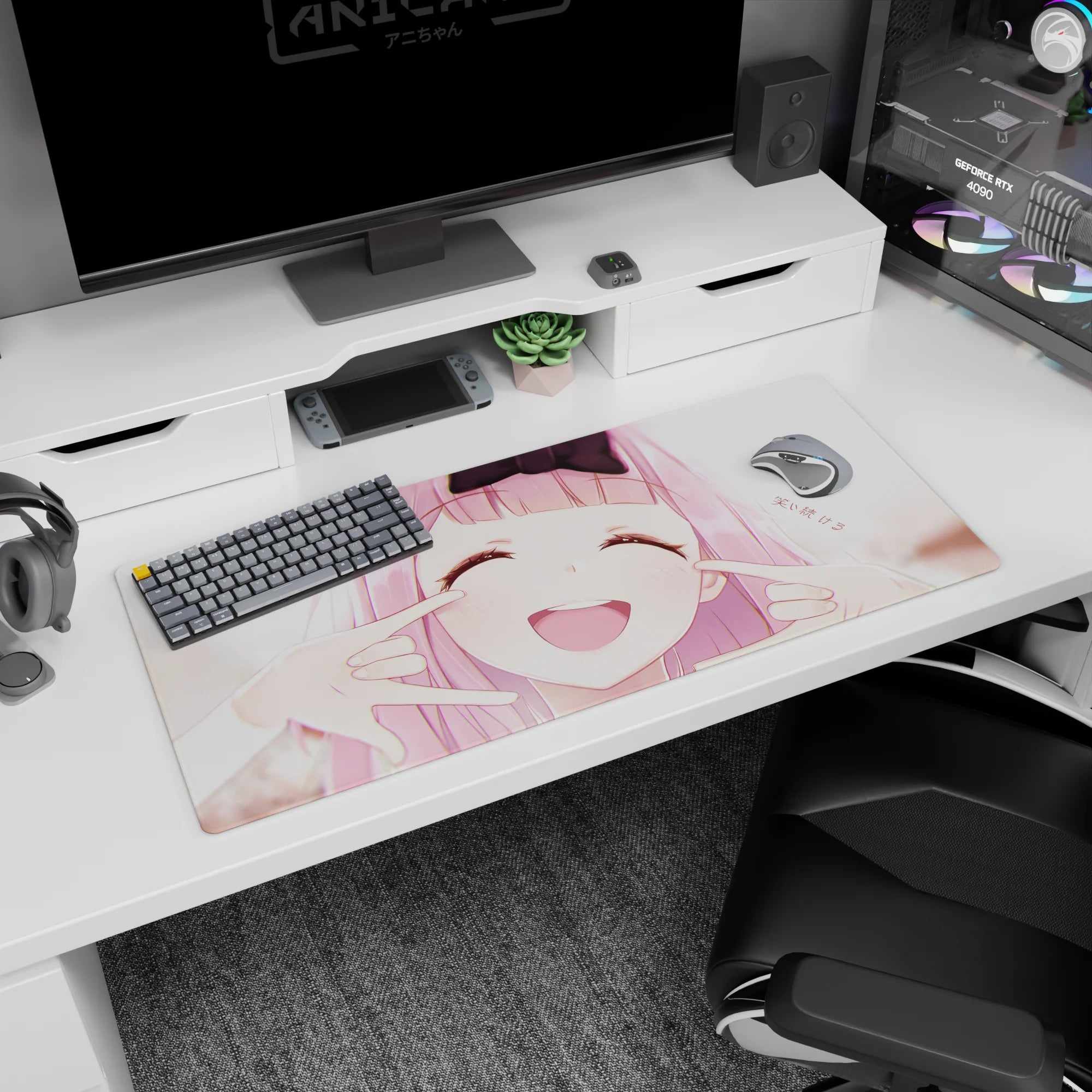 Pink-haired anime girl with eyes closed and cheeks squished into a grin desk pad 36x16 inches.