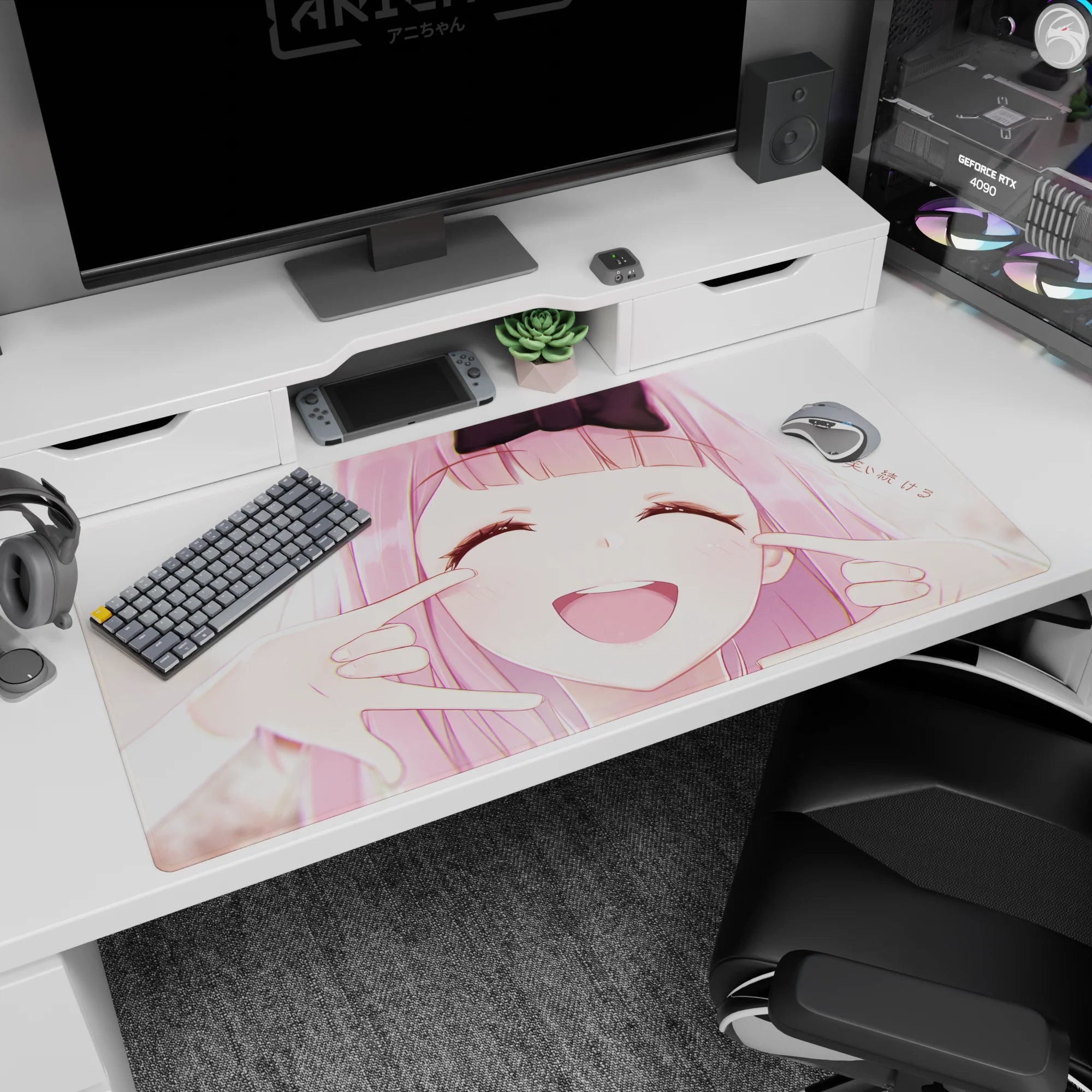 Anime girl desk pad 40x20 inches showing pink-haired girl with black bow, cheeks squished into grin.