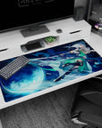 Silver-haired anime swordswoman desk pad 40x20 inches slashing beneath a bright full moon.
