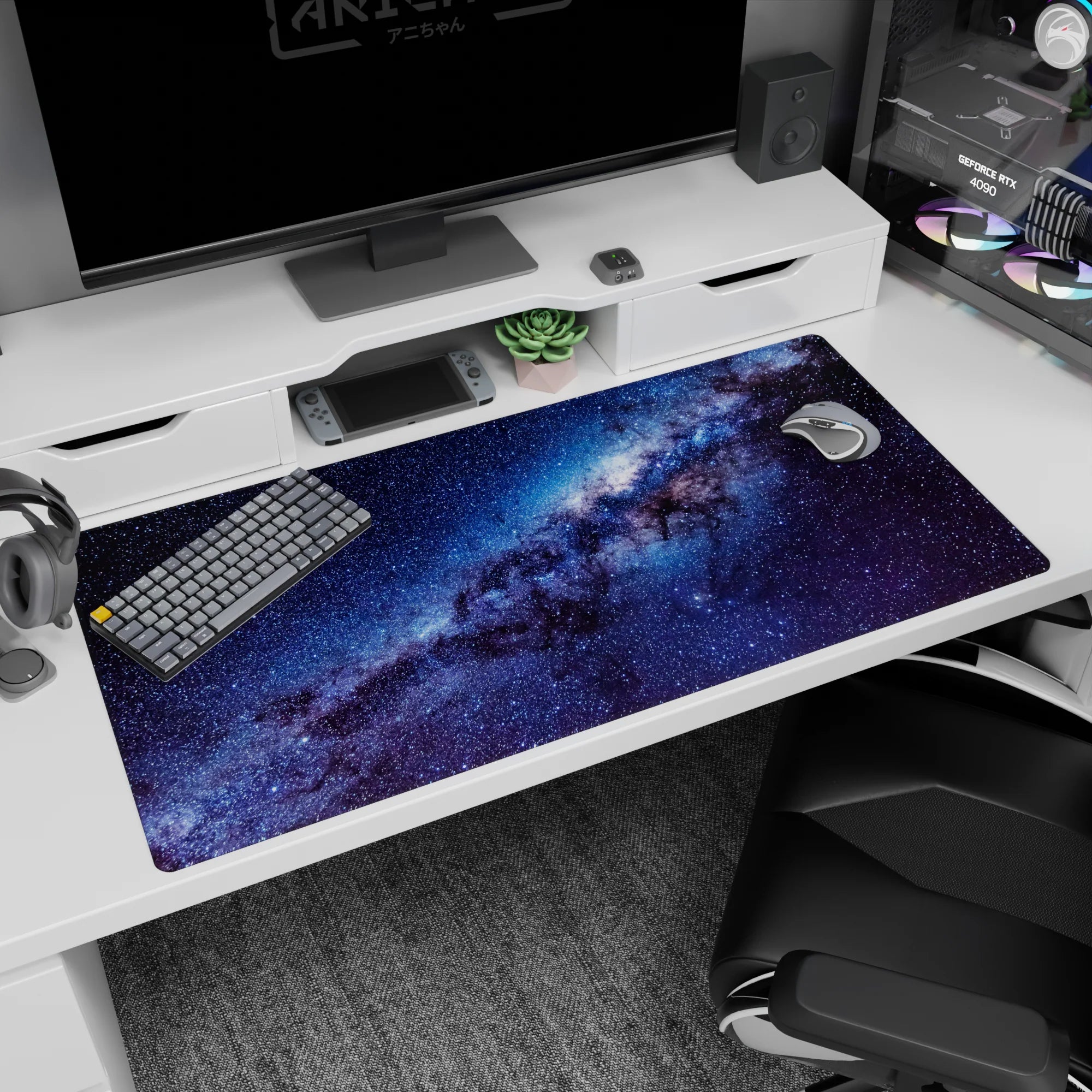 Galaxy ribbon scene desk pad 40x20 inches with glittering stars across an inky night sky.
