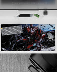 32x16 inches anime mouse pad in reds, gunmetal gray, and white over deep blues, loud heroic energy.