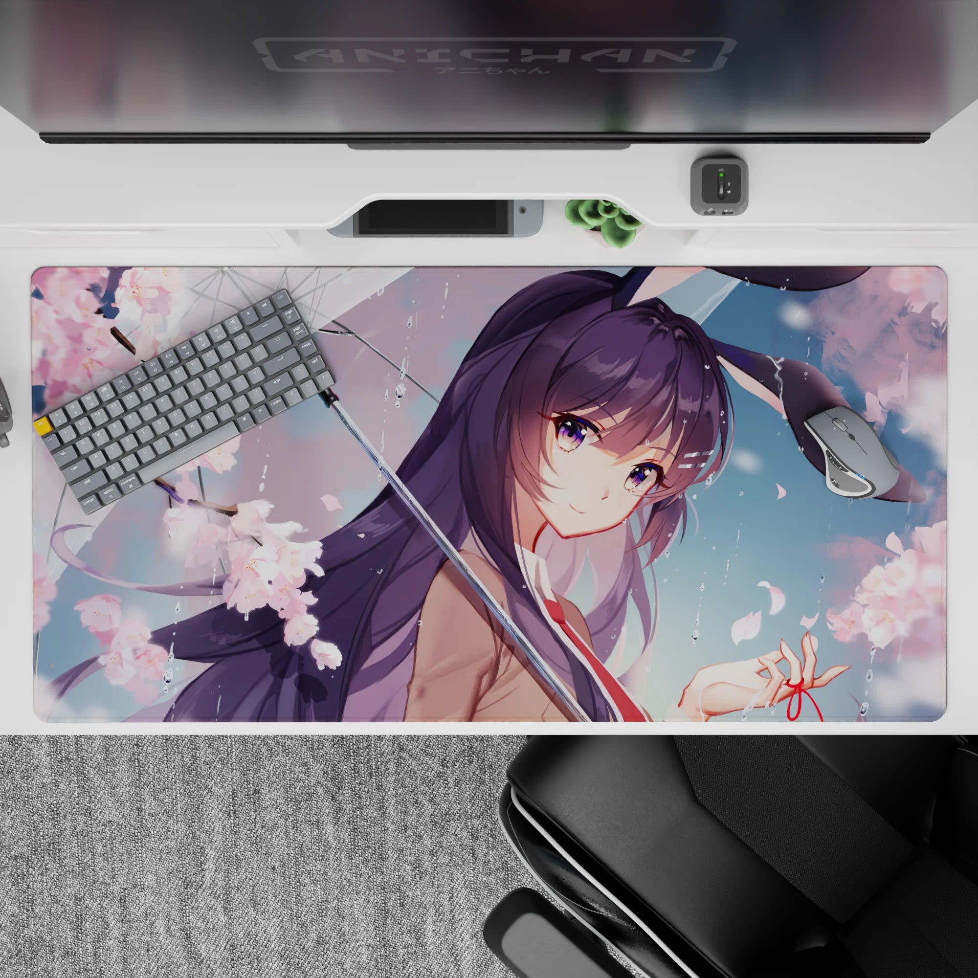 Pastel spring romance desk pad 40x20 inches in pink and violet tones with rain droplets and soft glow.