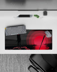 28x12 inches anime mouse pad in smoky blacks and deep grays with a glowing red sun reflection, moody art.