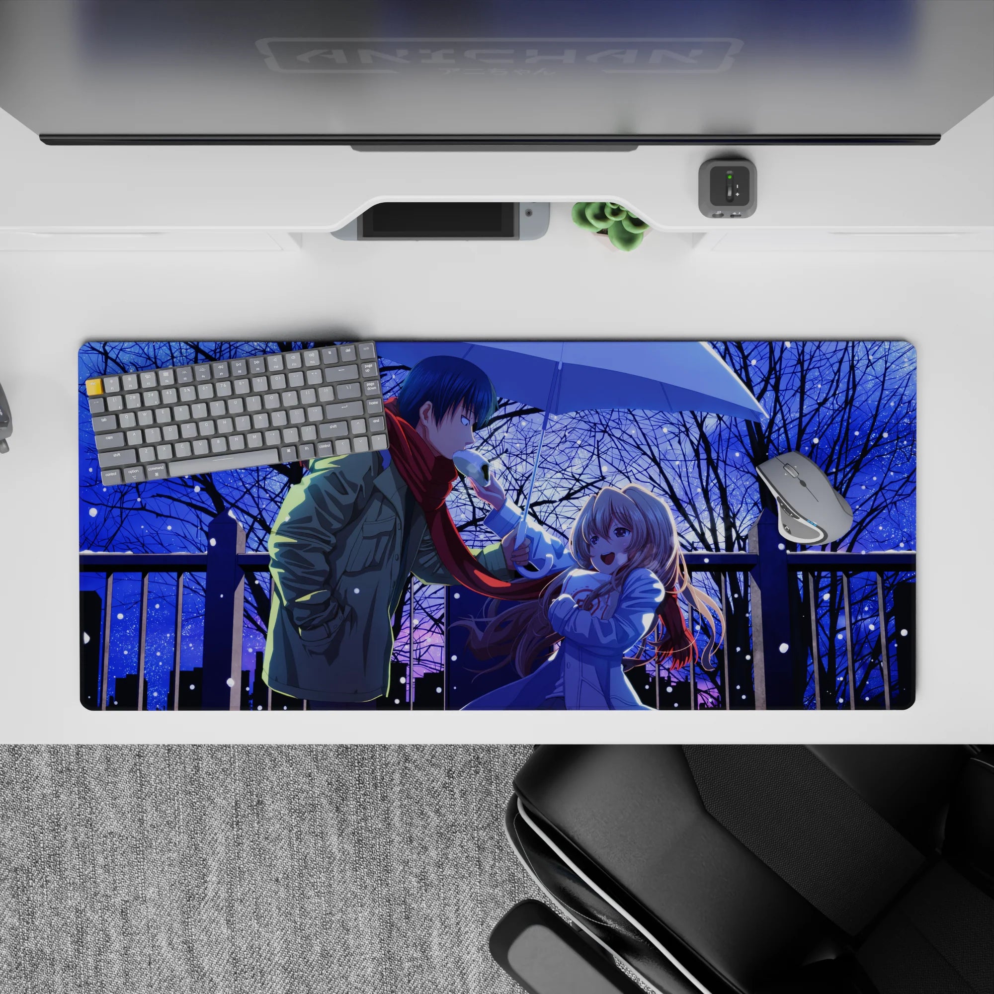 36x16 inches anime desk pad in deep midnight blues, snowy glitter, black branches, cozy romantic mood.