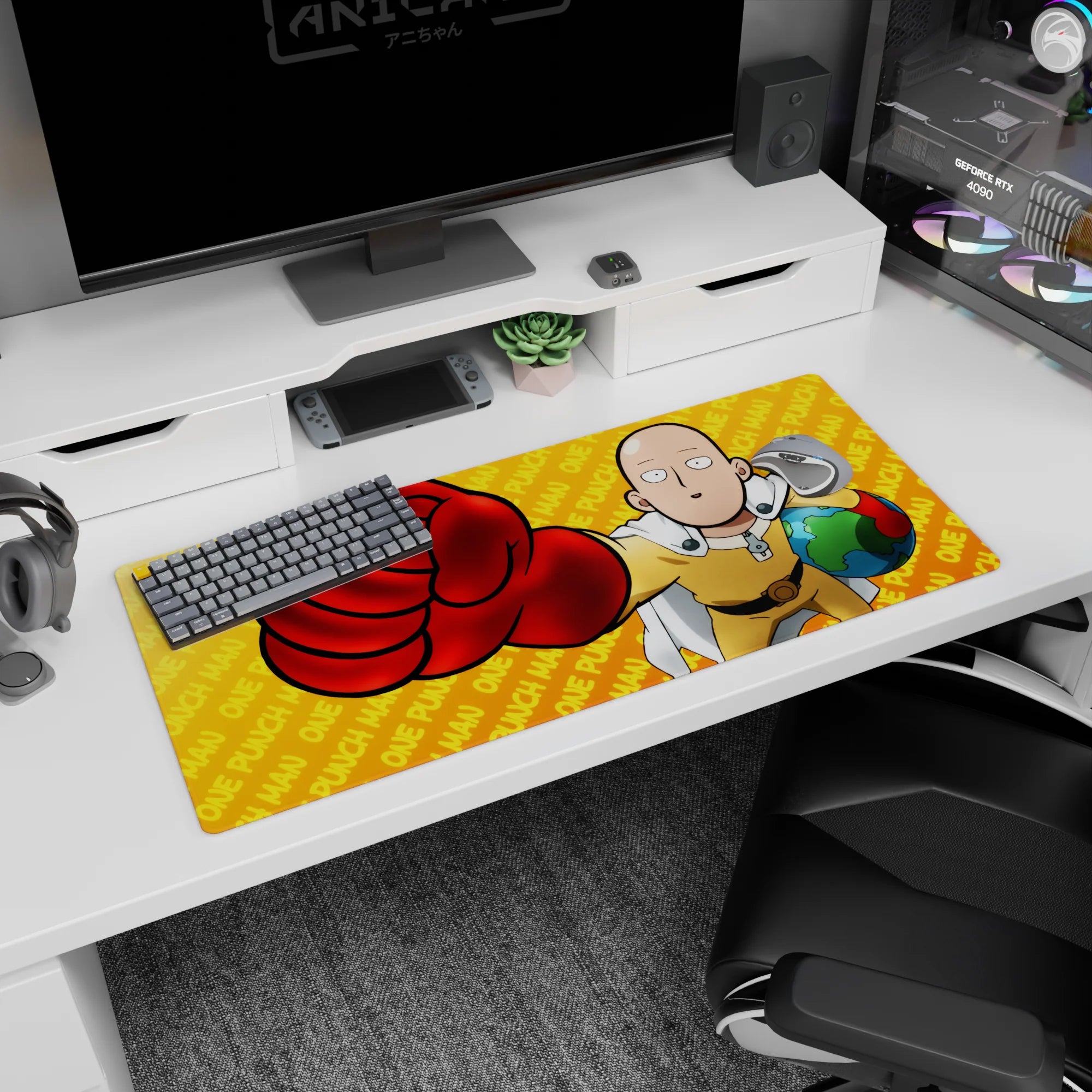 Saitama from One Punch Man aiming his red glove at you on a 36x16 inches anime desk pad.