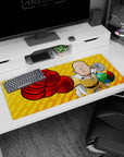 Saitama from One Punch Man aiming his red glove at you on a 36x16 inches anime desk pad.