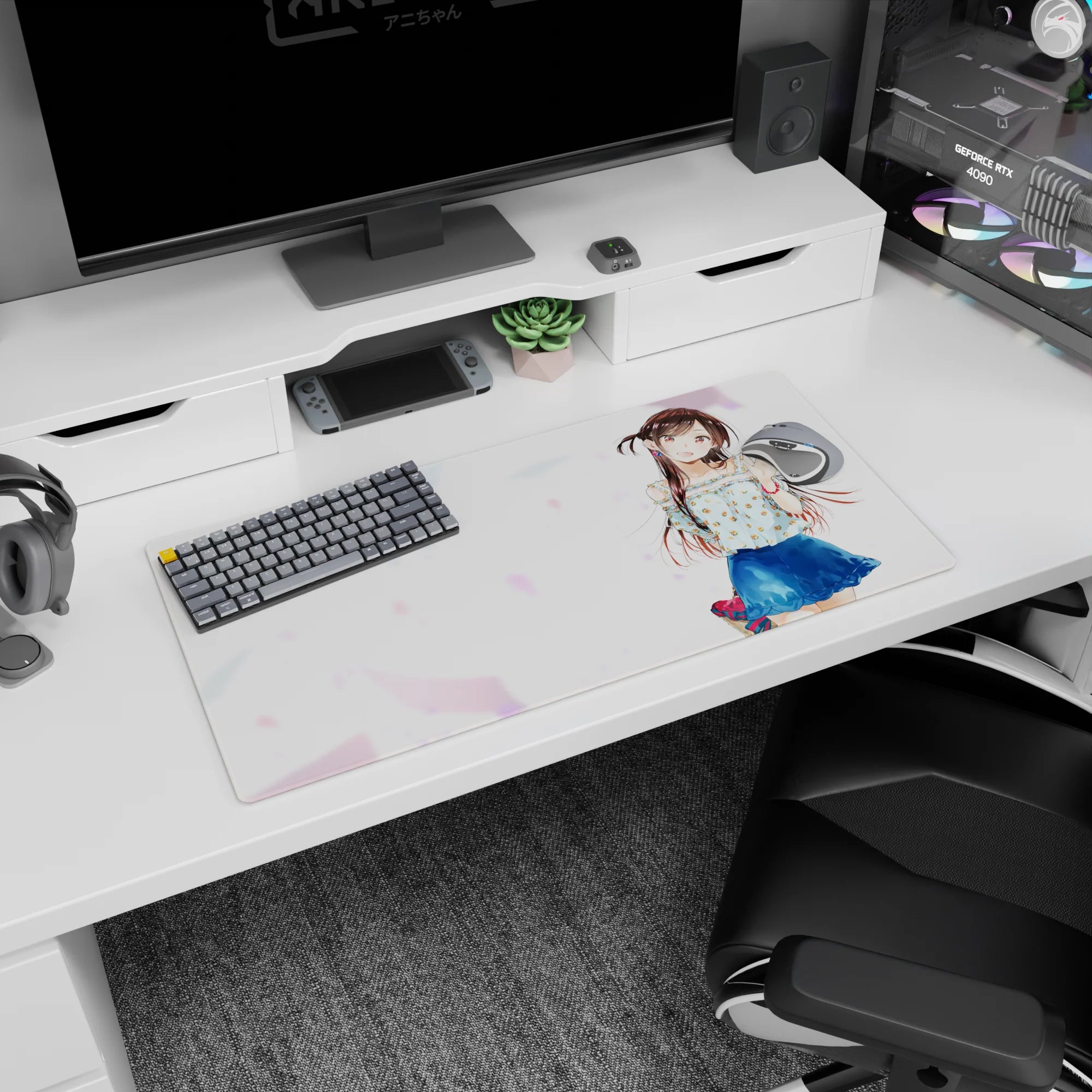 32x16 inches mouse pad showing glossy-eyed anime girl waving, chestnut twin-tails, floral blouse, navy skirt.