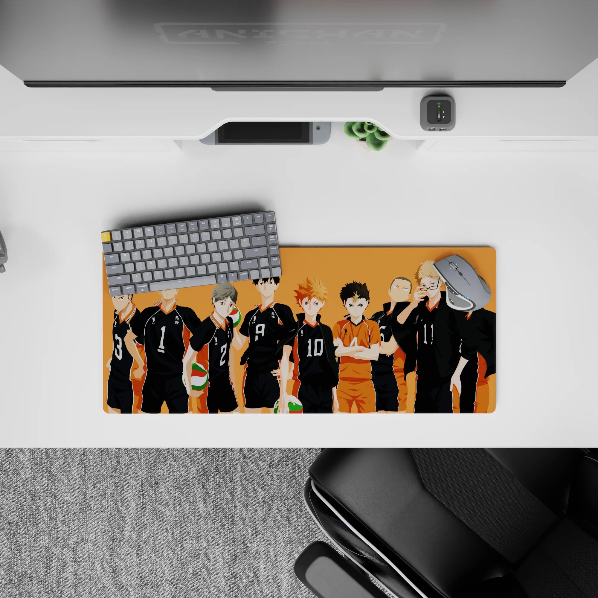 Warm sunset-orange anime mouse pad 28x12 inches with black jerseys, white numbers, and bright libero.