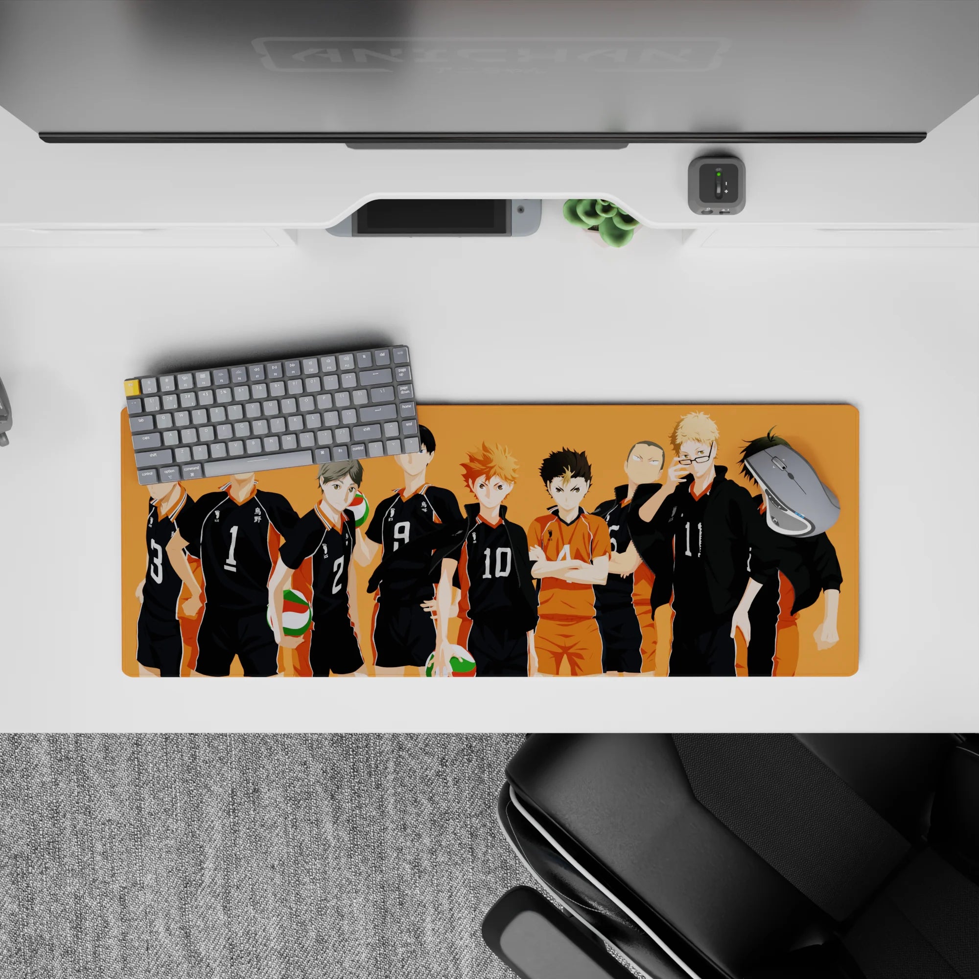 Sunset-orange gym vibe anime mouse pad, 32x12 inches, black jerseys, white numbers, green-red volleyballs.