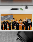 Sunset-orange gym vibe anime mouse pad with bold black jerseys and spark-orange libero, 32x16 inches.