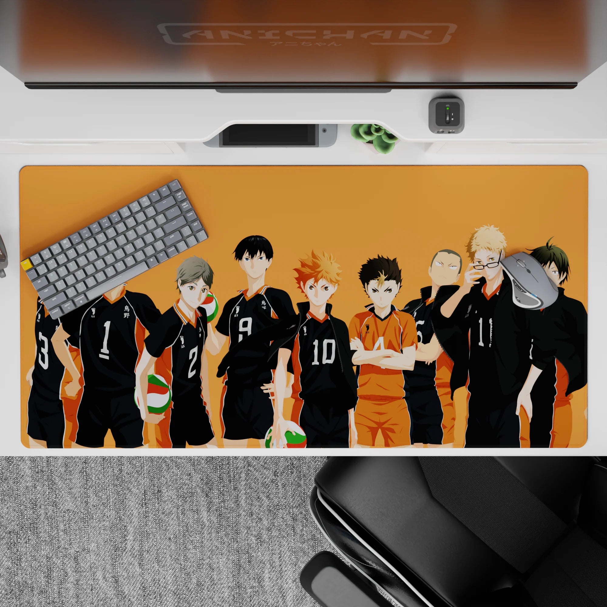 Sunset-orange anime desk pad 40x20 inches with black uniforms, white numbers, and a bright orange libero.