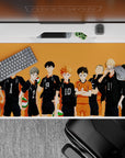 Sunset-orange anime desk pad 40x20 inches with black uniforms, white numbers, and a bright orange libero.