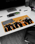 Haikyuu Karasuno team lineup with crossed arms and green-red volleyballs anime mouse pad, 32x16 inches.