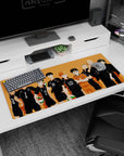 Confident spiky-haired volleyball team with crossed arms on anime desk pad 36x16 inches, minimalist.