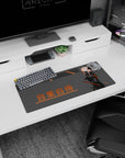 Masked anime girl in glossy black suit holding a katana on a 28x12 inches desk mouse pad.