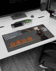 Pink-haired masked swordswoman in glossy black suit on anime mouse pad 32x16 inches, katana ready.
