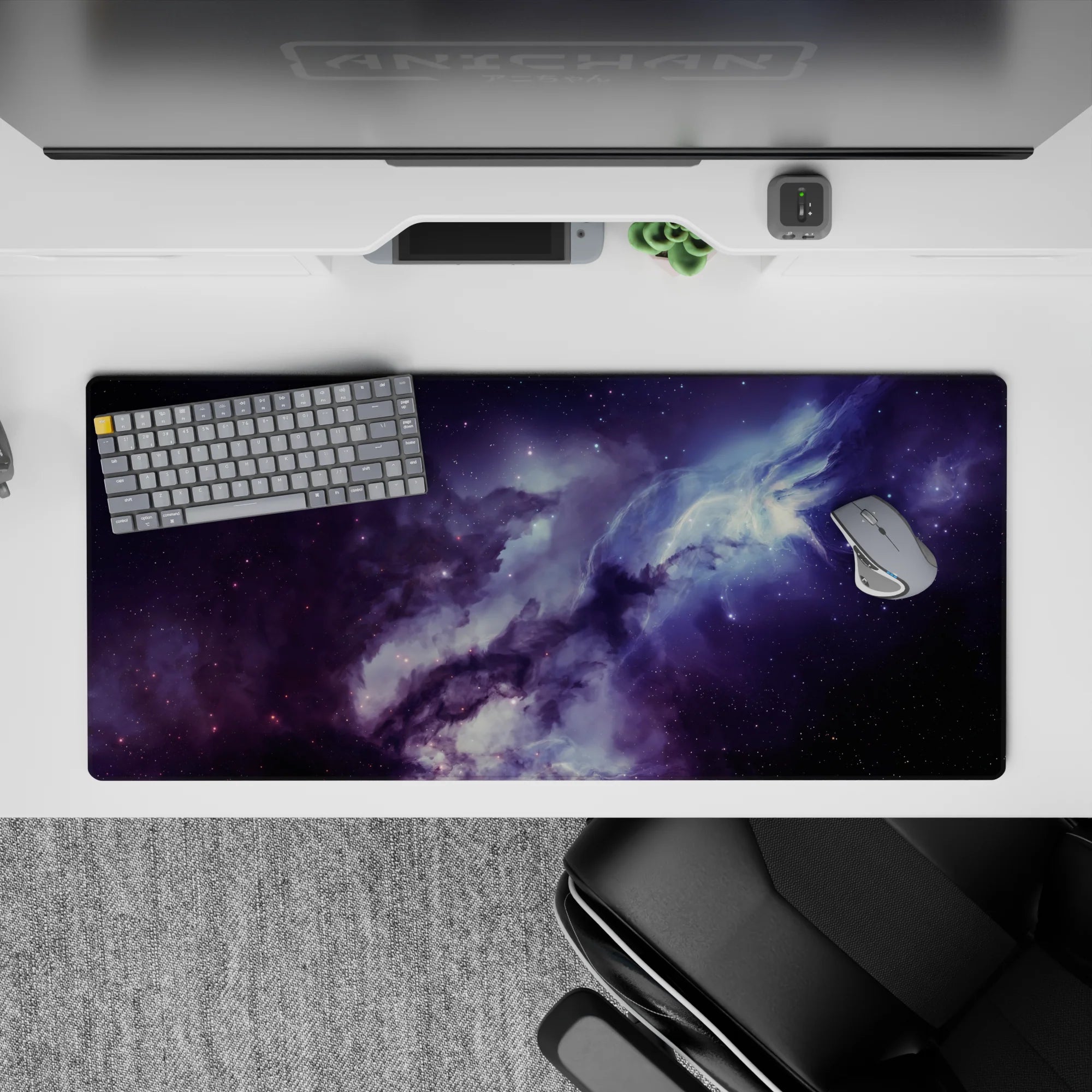 Smoky purples and midnight blues calming space-themed desk pad, 36x16 inches.