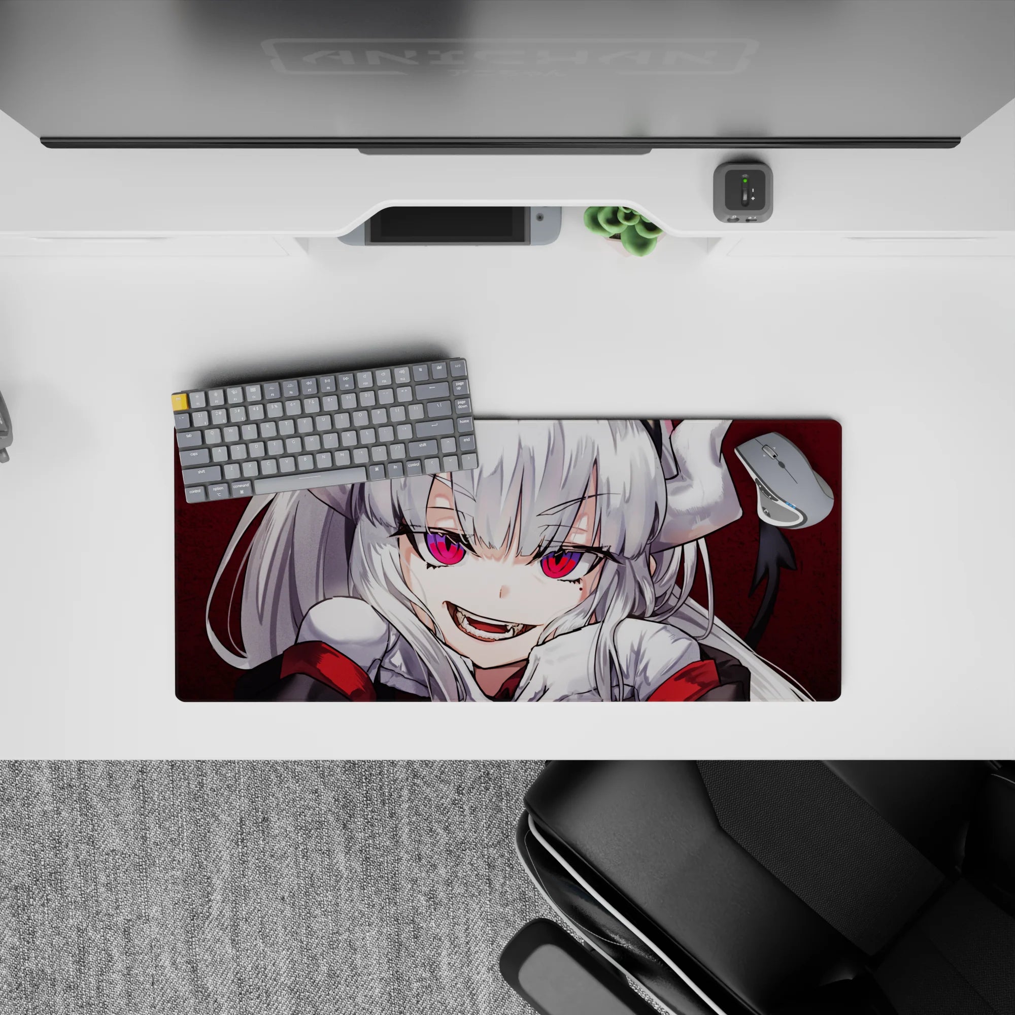 28x12 inches anime desk mat in deep crimson with mischievous grin, high-contrast print, hot pink eyes.