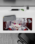 28x12 inches anime desk mat in deep crimson with mischievous grin, high-contrast print, hot pink eyes.