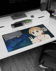 Big-eyed anime girl flashing double peace sign on mouse pad 32x16 inches, sandy-brown hair and pink cheeks.