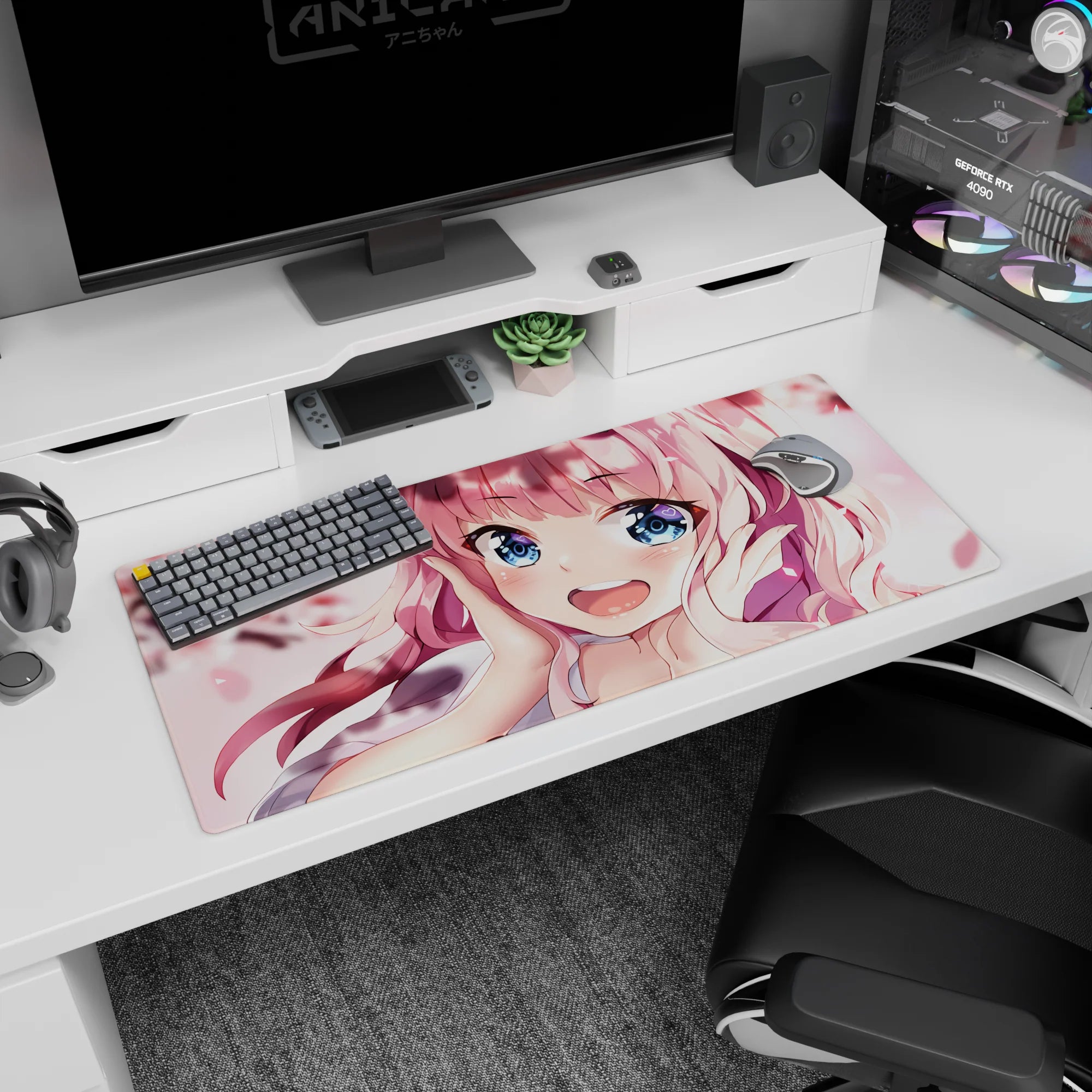 Close-up pink-haired anime girl with heart highlights and drifting sakura petals desk pad 36x16 inches.