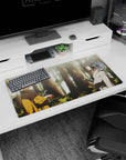 Naruto and Sasuke facing off in a quiet wooded clearing, smooth anime desk mat 32x16 inches.